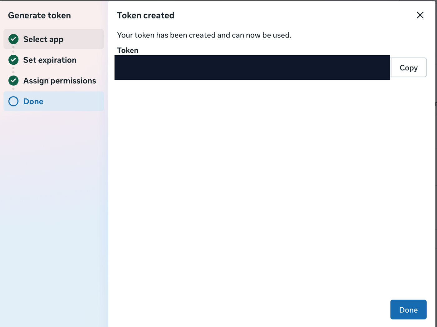 Meta Token created dialog with the token value redacted and the Copy button visible — Meta shows a System User access token only once.